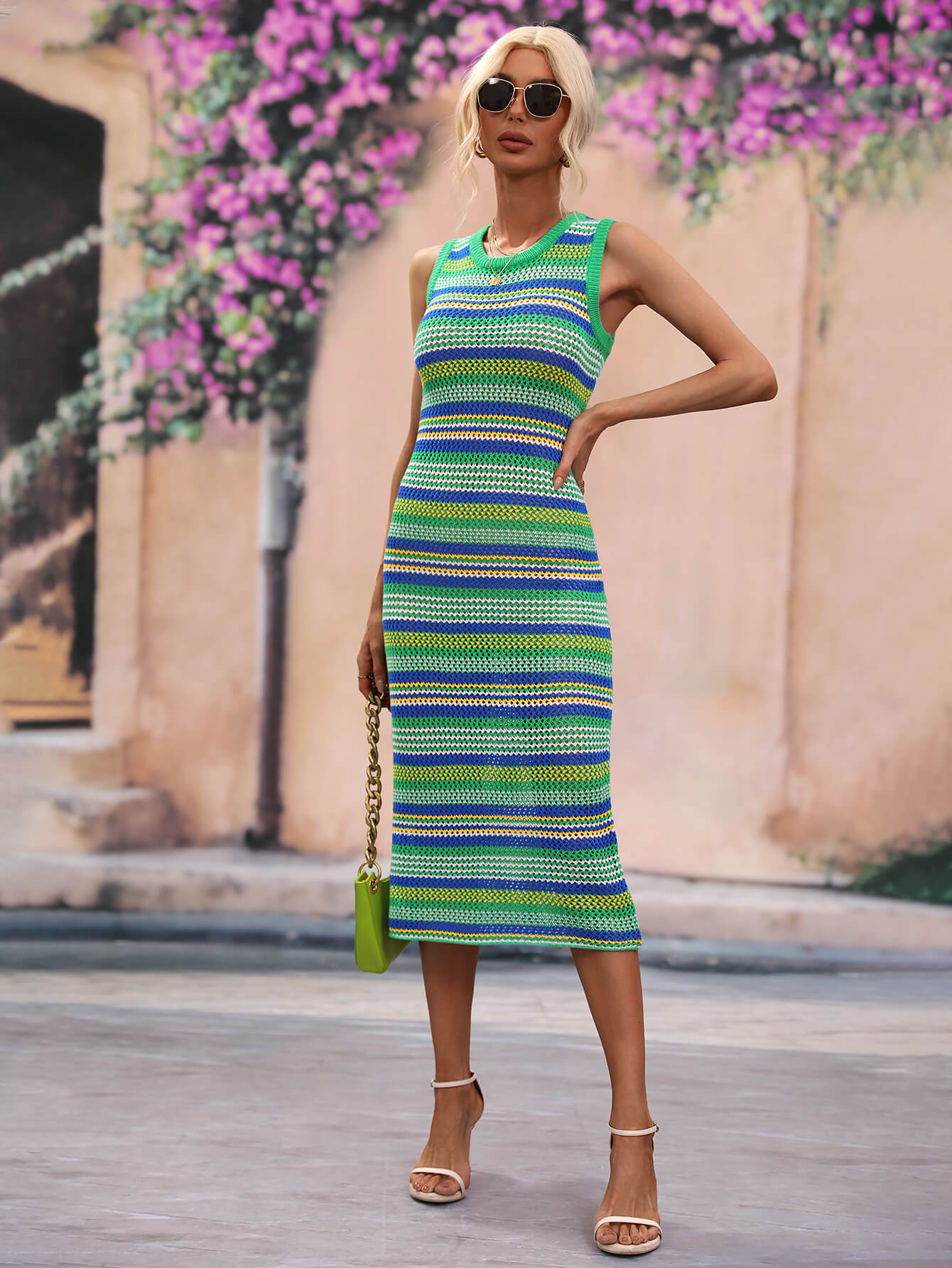 Woman wearing striped sleeveless midi cover-up dress outdoors