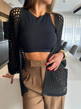 Front view of black hollow out open front beach cover-up
