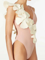 Soft blush one-piece swimsuit with floral pattern