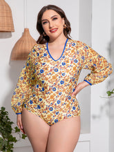 Front view of Plus Size Floral Open Back Long Sleeve One-Piece Swimsuit in gold floral print