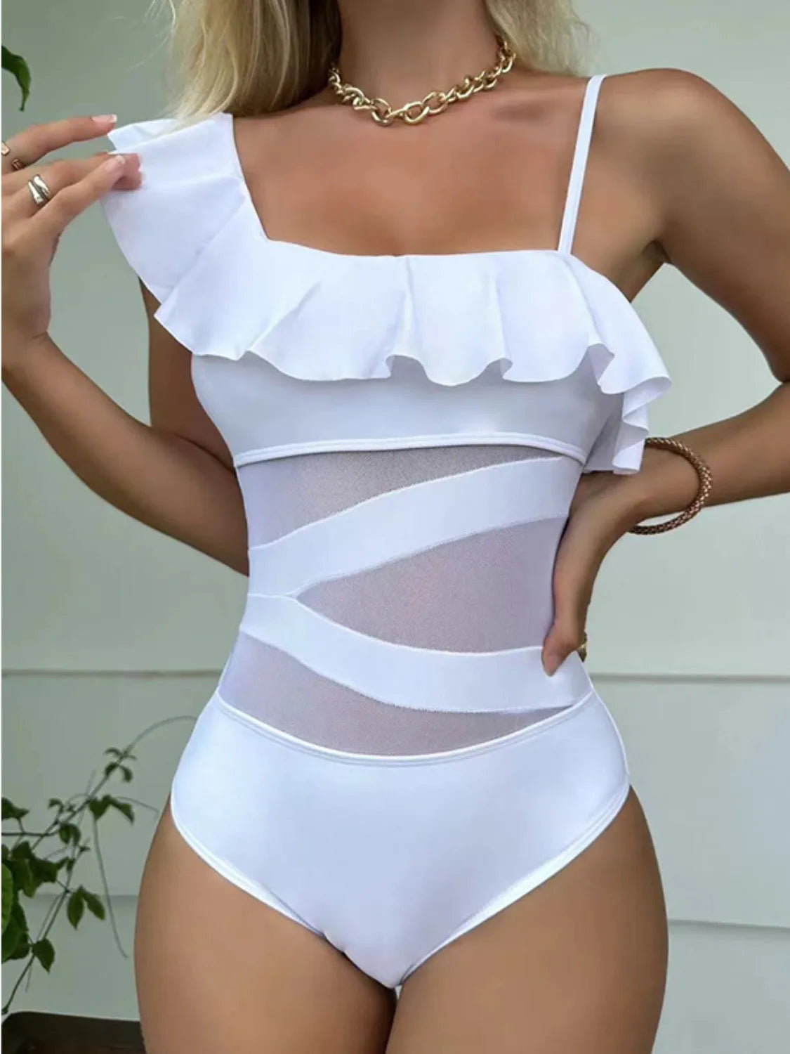 White one-piece swimsuit with ruffle detail