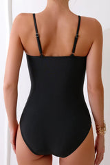Bold black swimsuit with cutout design