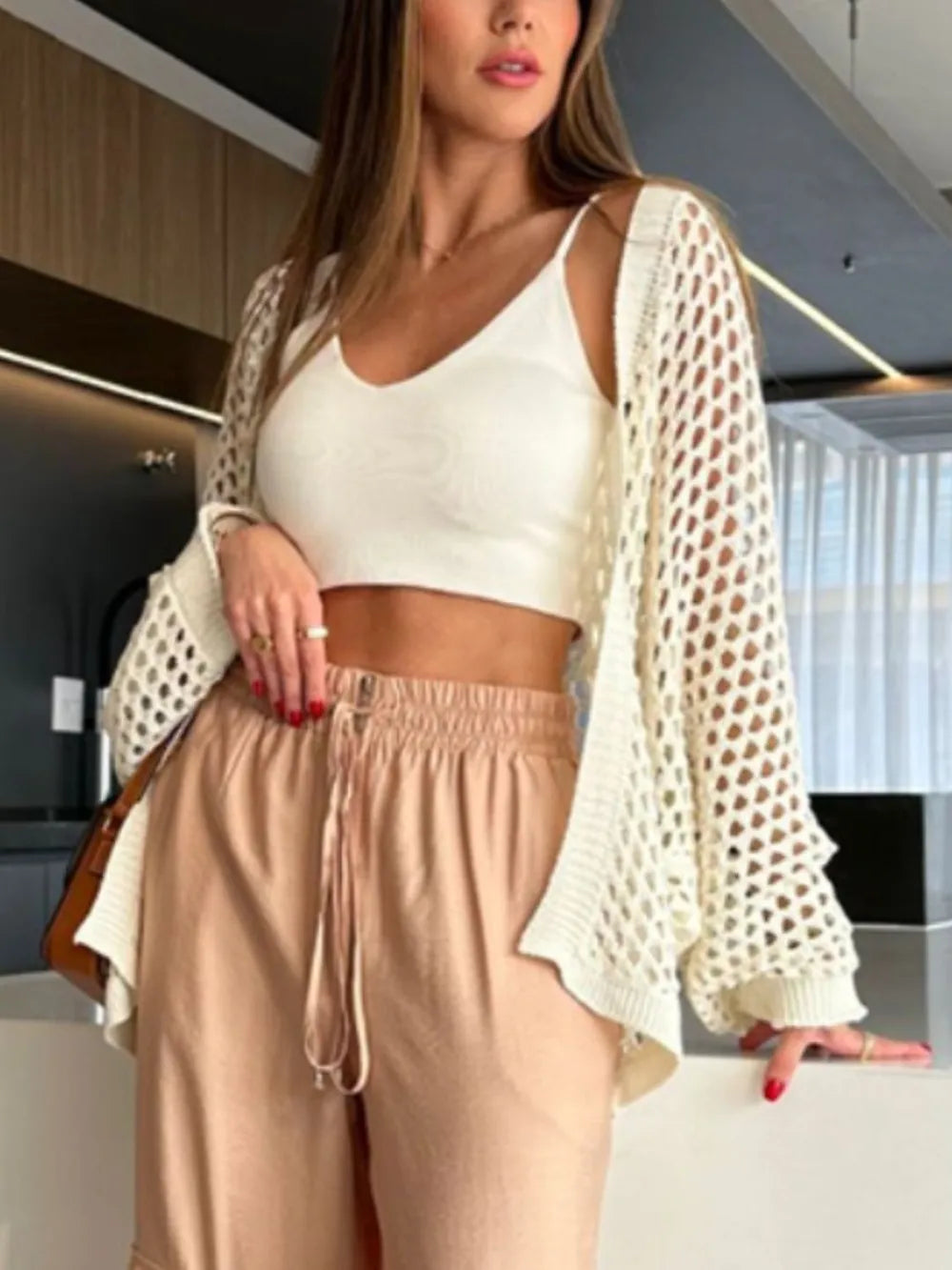 Front view of cream hollow out open front beach cover-up