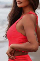 Swim top with scoop neckline and red straps