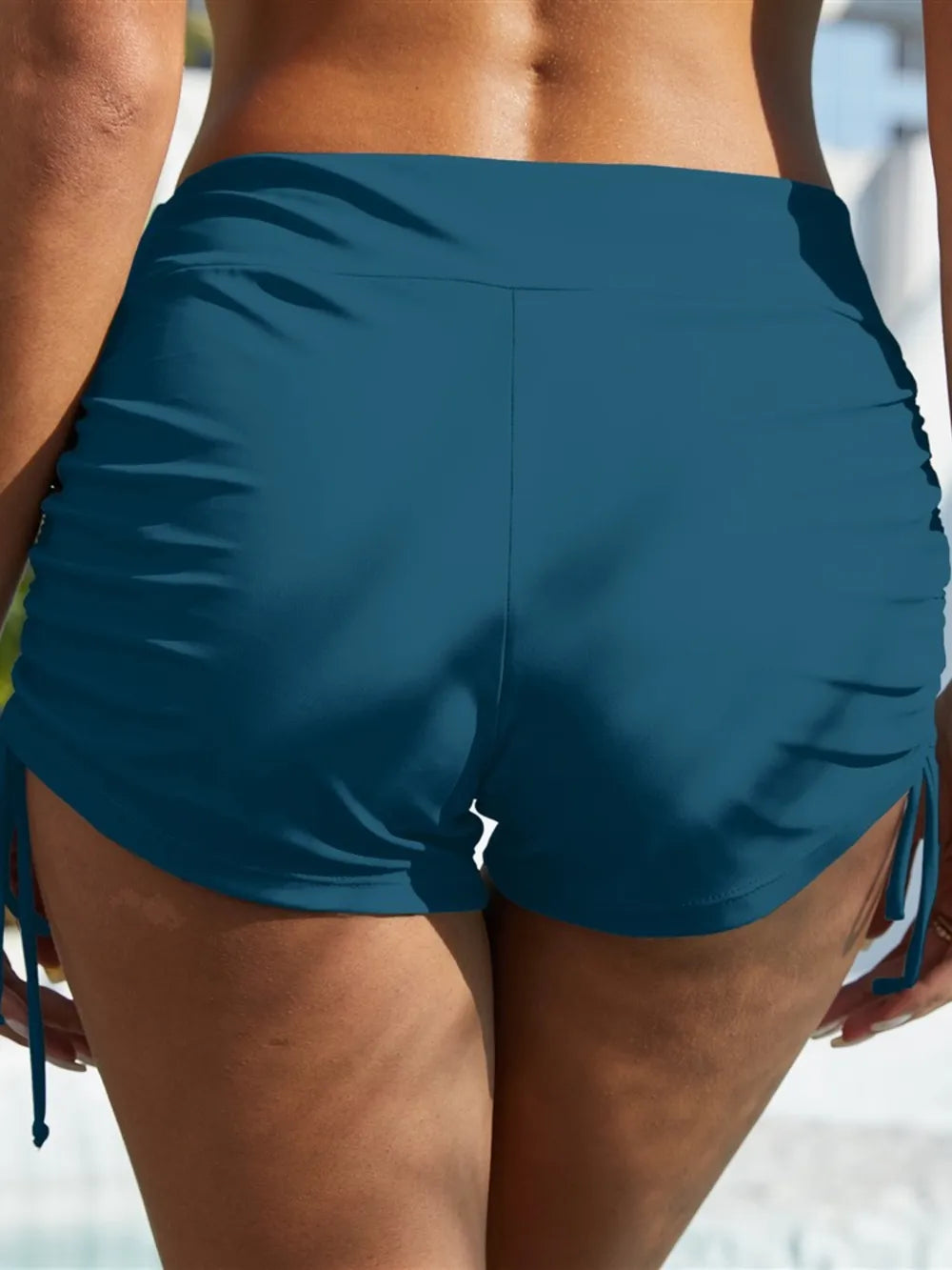 drawstring mid-rise waist swim shorts deep teal back view