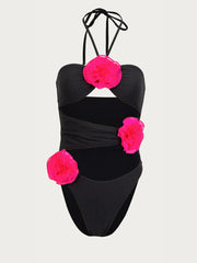 Front-facing black swimsuit with floral cutout and halter tie