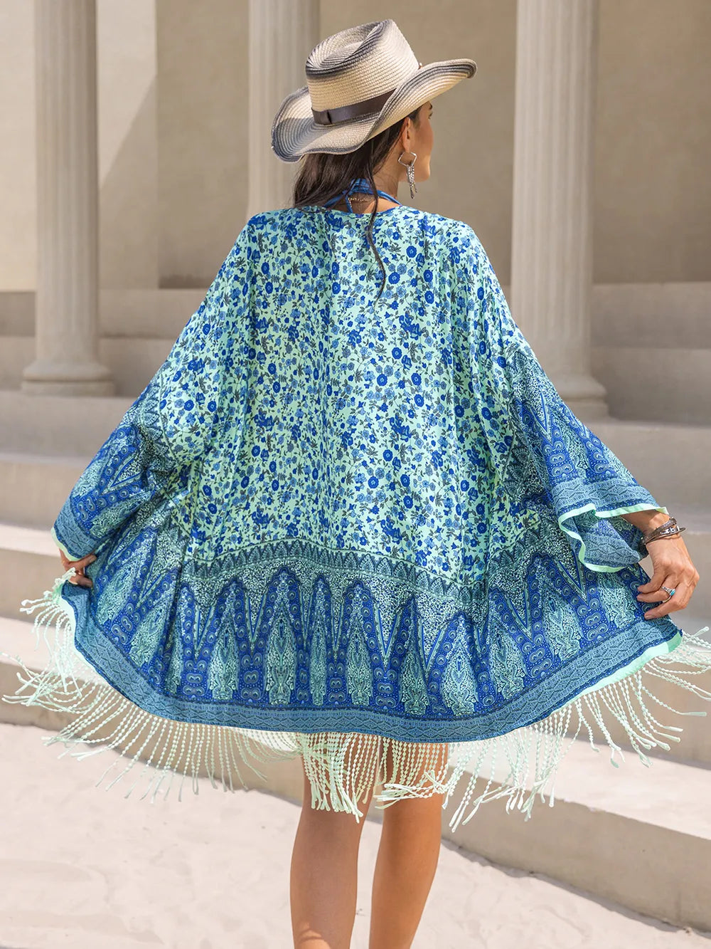 Back view of pastel blue fringe beach cover-up
