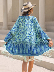 Back view of pastel blue fringe beach cover-up