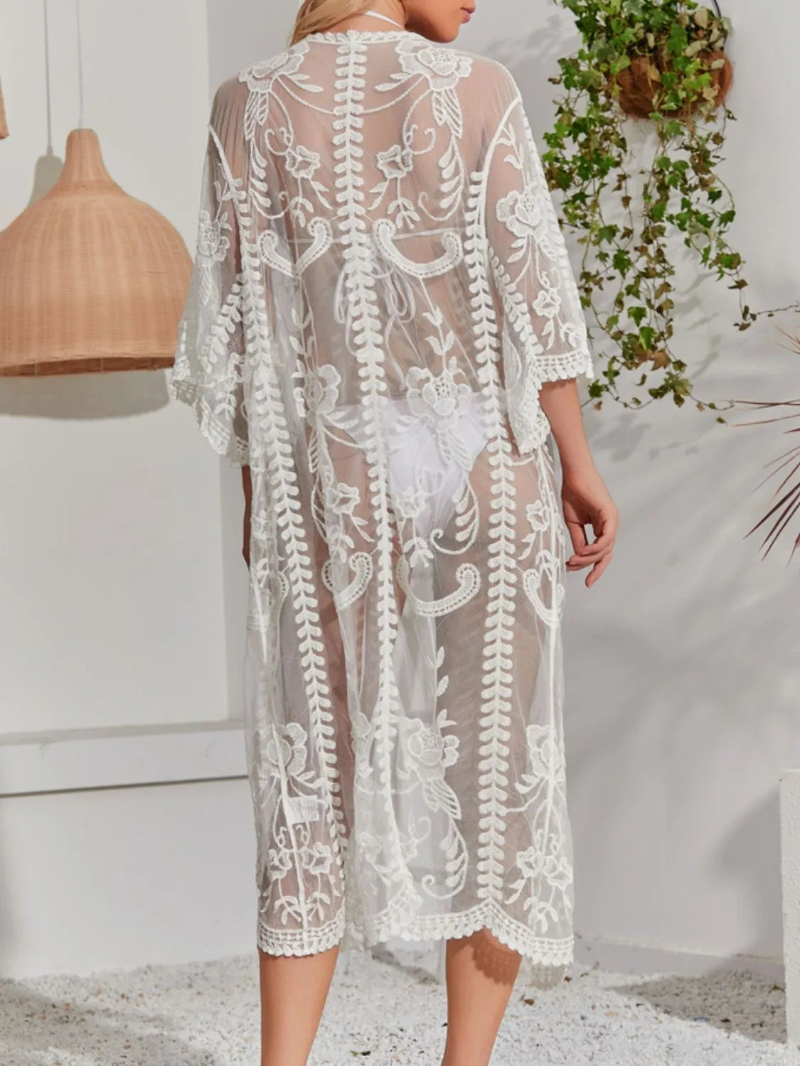 Sheer lace back of white beach cover-up