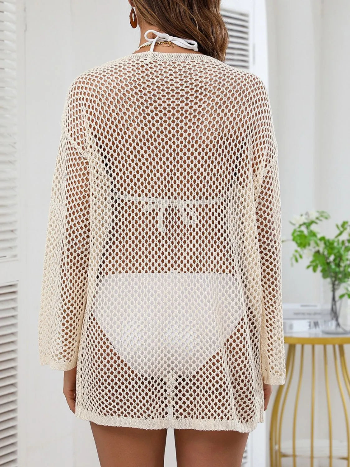  Rear view of beige openwork cover-up