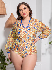 Front view of Plus Size Floral Open Back Long Sleeve One-Piece Swimsuit in gold floral print