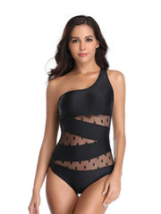 One-shoulder swimsuit with polka dots in black