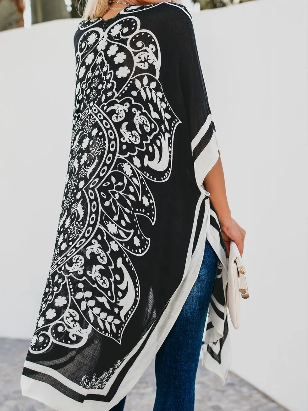 Back view of black printed open front cover-up