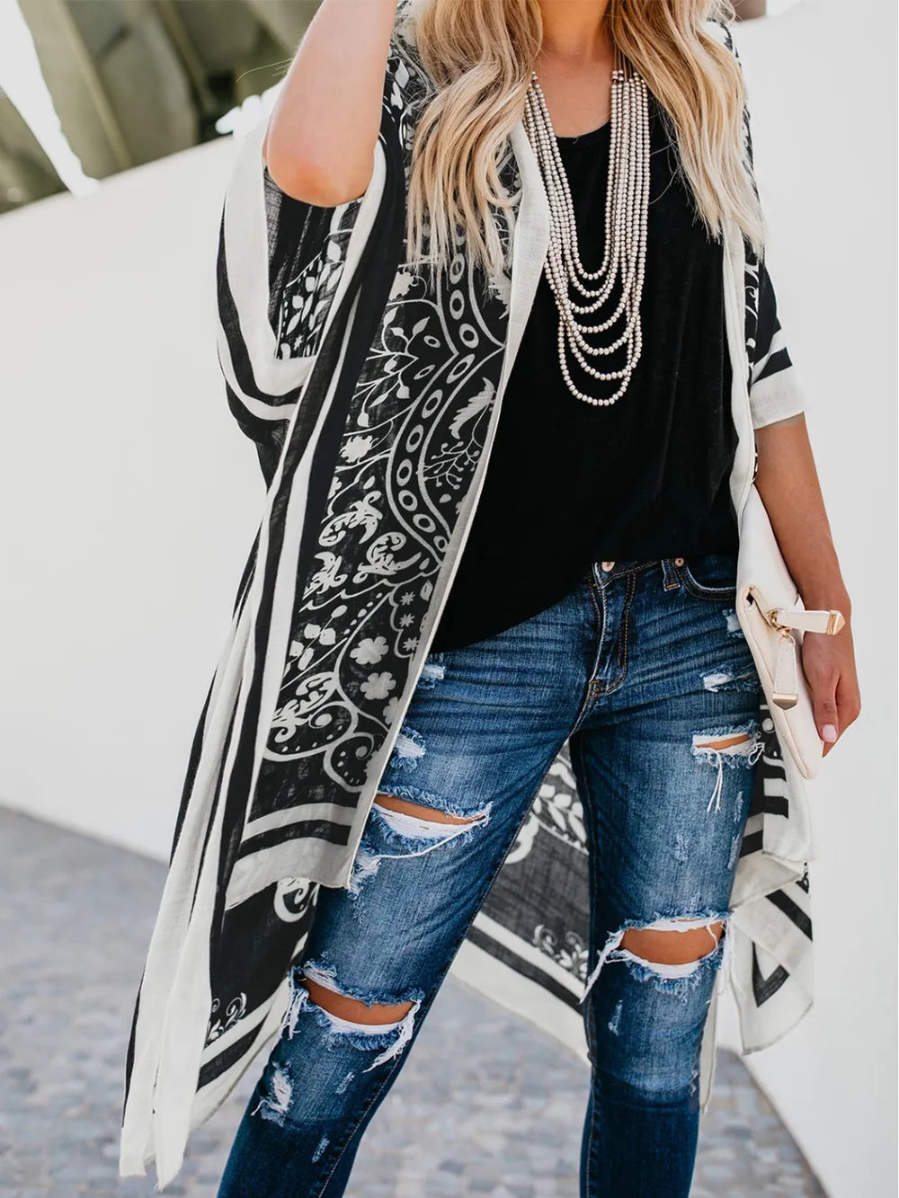 Front view of black printed open front cover-up