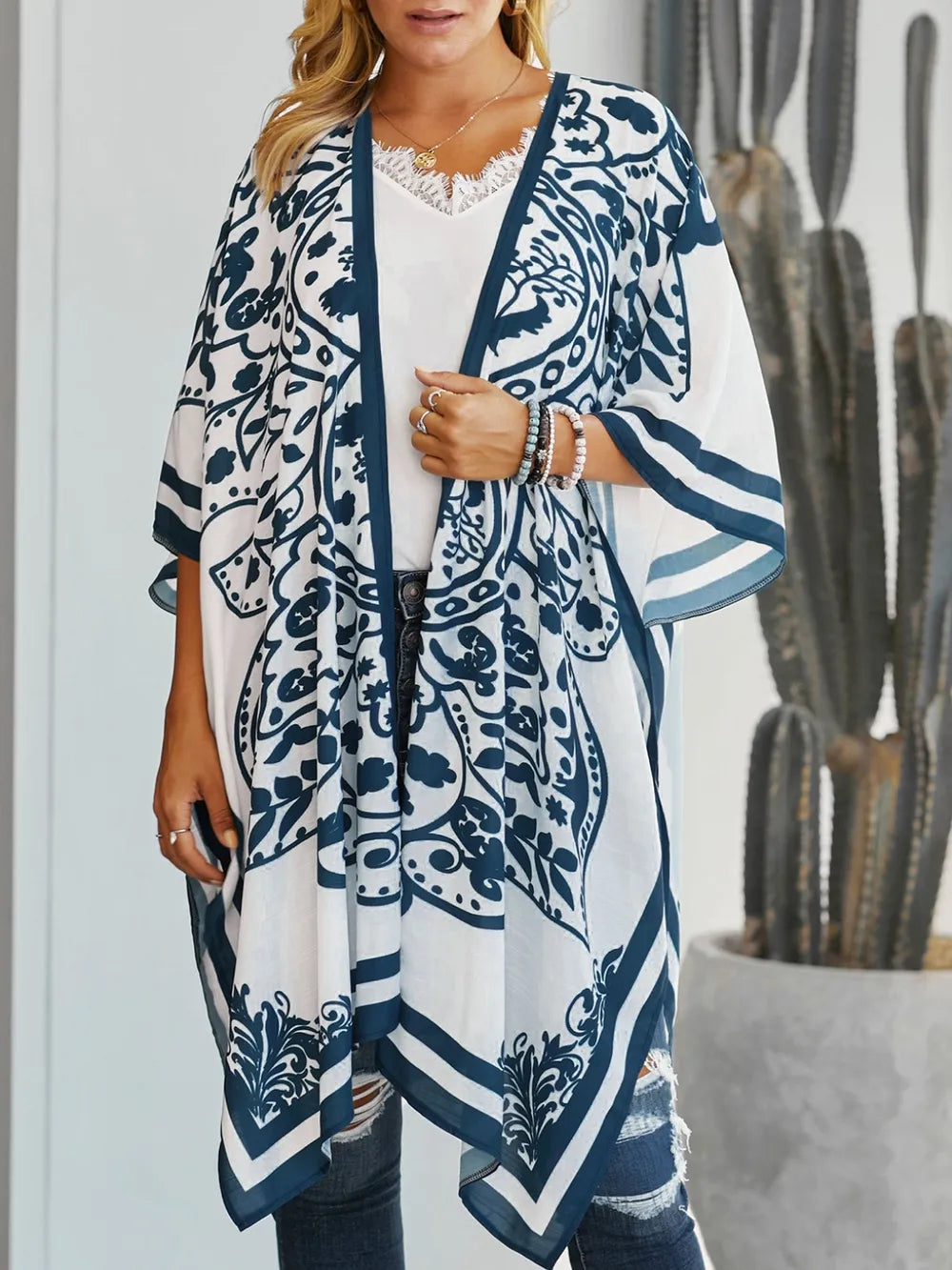 Front view of white printed open front cover-up