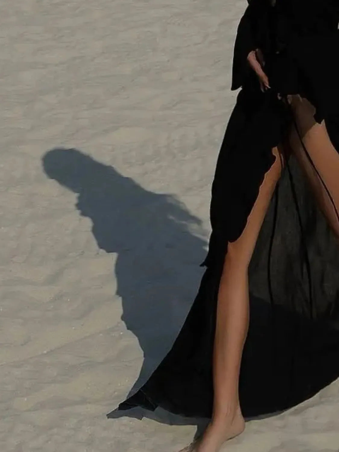 Front view of black ruffled swim cover-up