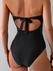 Back view black swimsuit with open back and tied finish